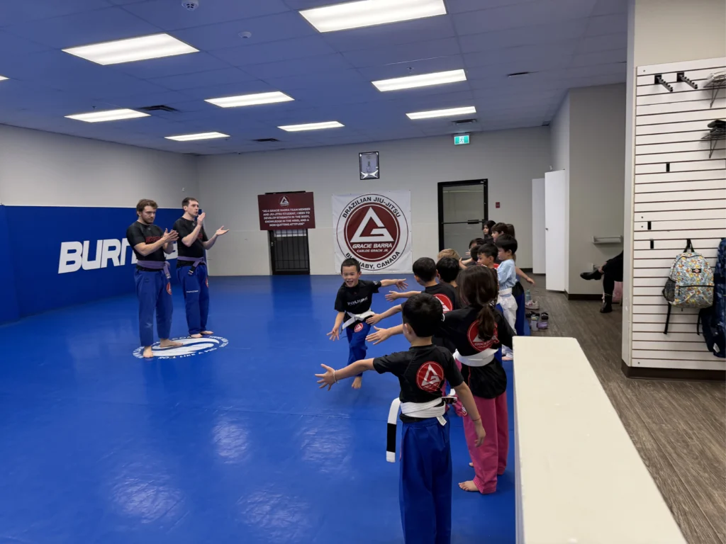 Kids training in bjj teacher self-defense