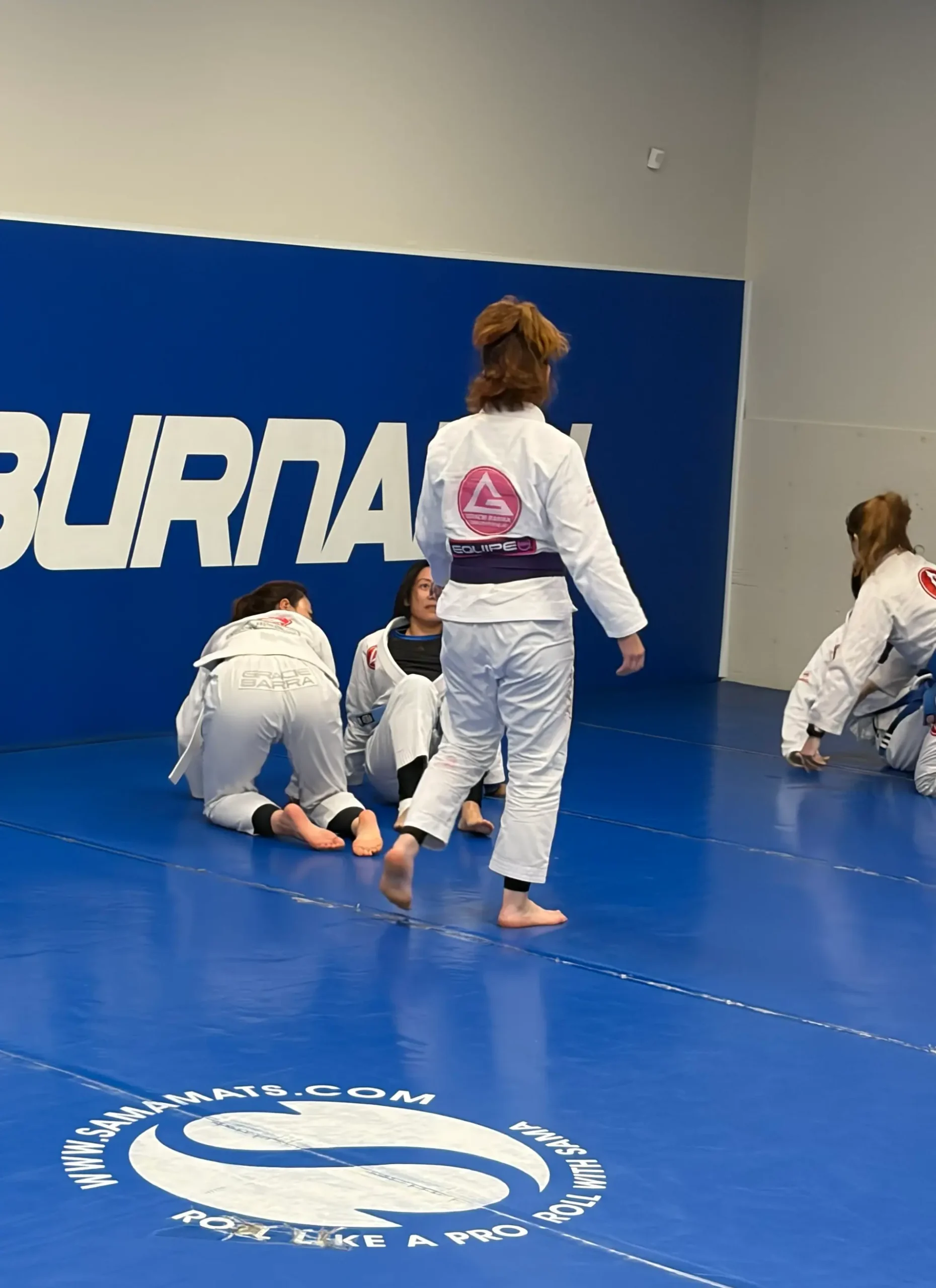 Gracie Barra Burnaby female student with her family at the academy